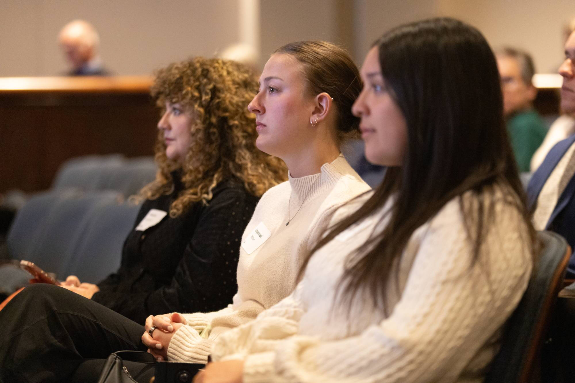 Students listen during the presentation